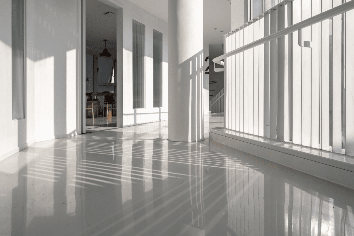 Bright hallway with reflections and shadows.